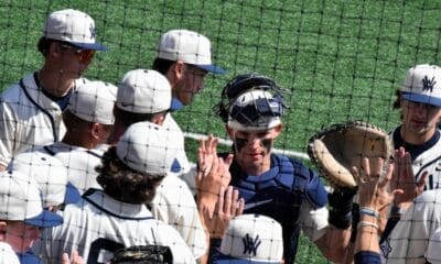 WVU Baseball players high fives