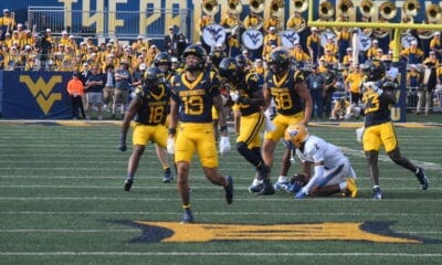 WVU Football defense celebrating against Pitt