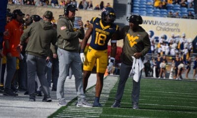 WVU Football HC Rich Rodriguez, Curtis Jones and Larry Porter