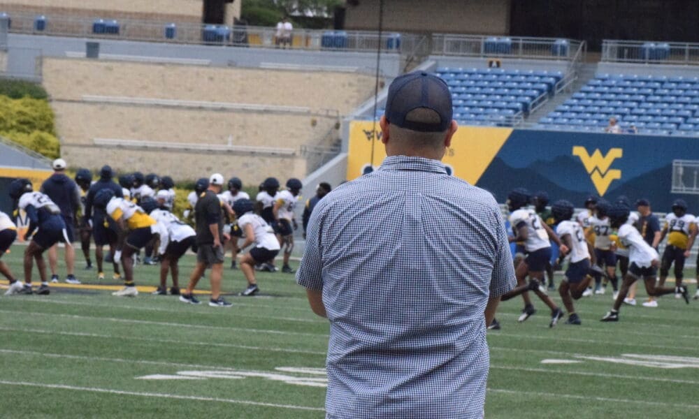 Mike Asti watching WVU football practice