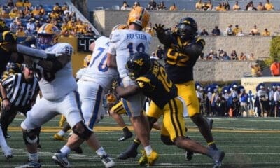 WVU Football defensive line sacking Pitt quarterback Eli Holstein