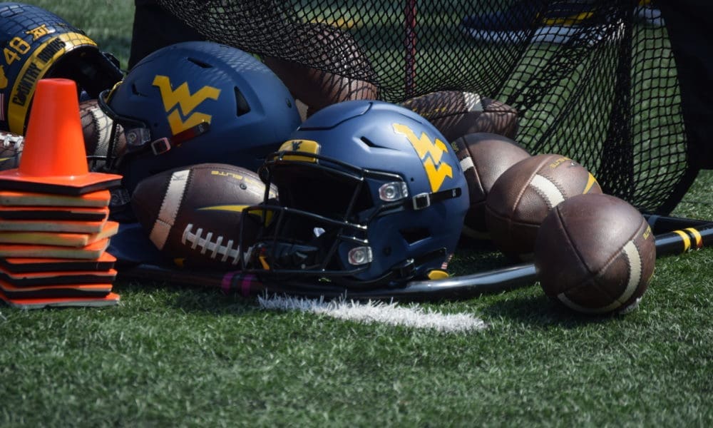 WVU footballs and helmets stock