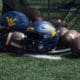 WVU footballs and helmets stock