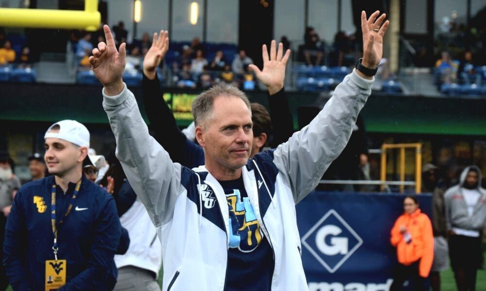 WVU Women's Basketball Head Coach Mark Kellogg at football game