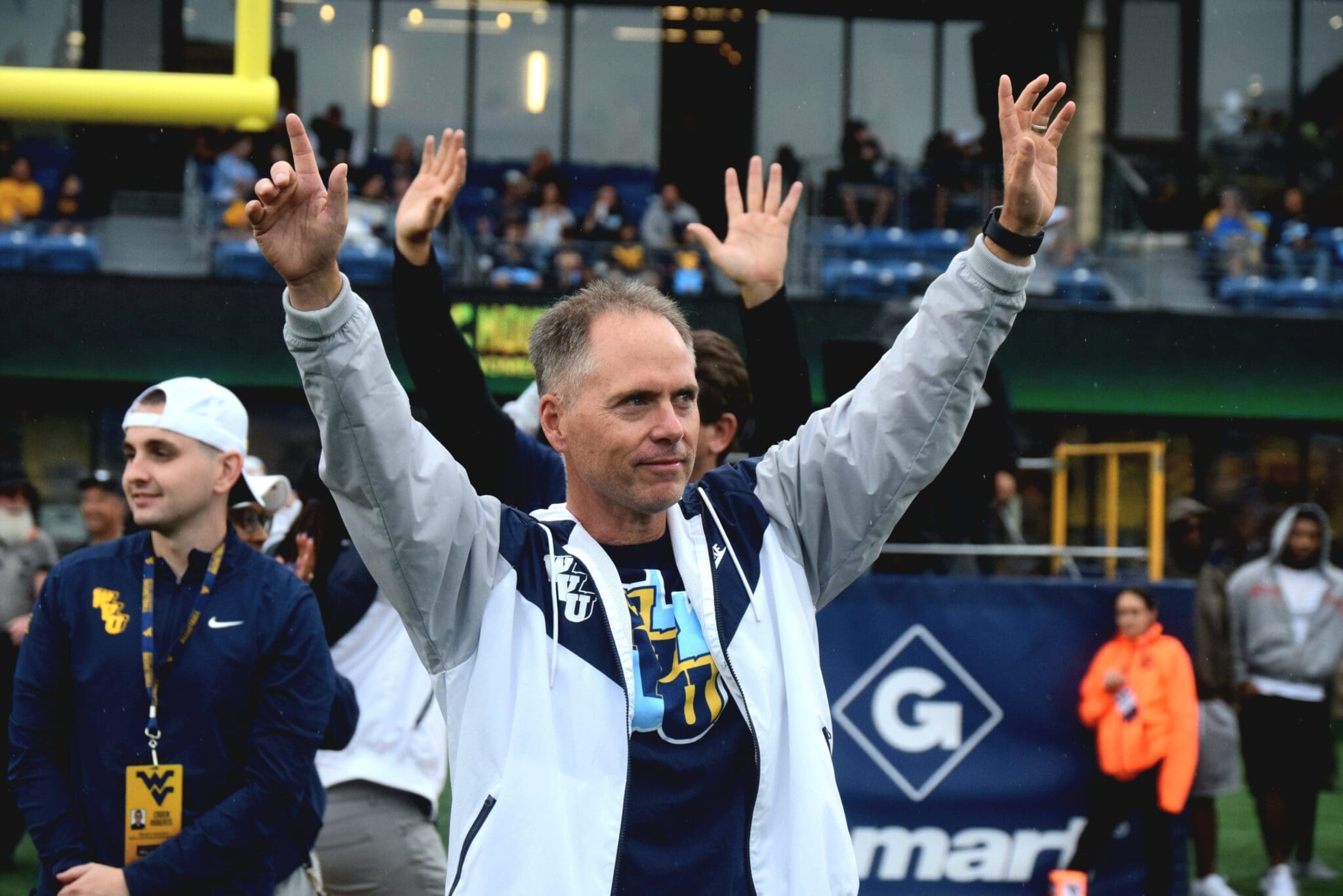WVU Women's Basketball Head Coach Mark Kellogg at football game