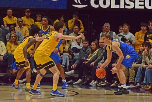 WVU Basketball Treysen Eaglestaff playing defense in Backyard Brawl against Pitt
