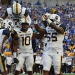 WVU defense celebrates at Pitt