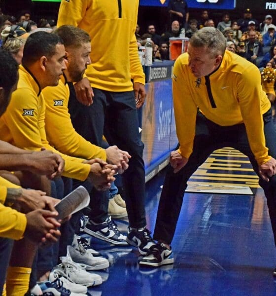 WVU Basketball HC Ross Hodge in huddle