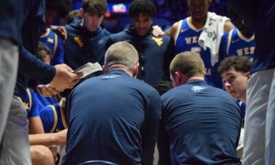 WVU Basketball huddle
