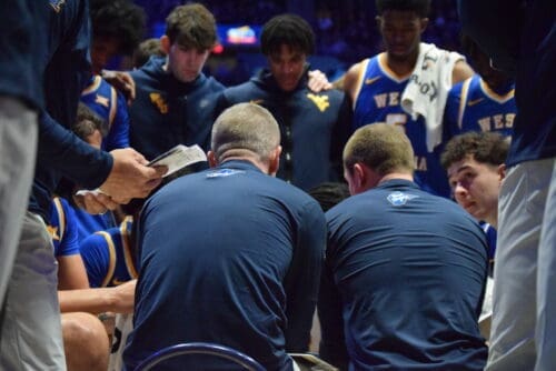 WVU Basketball huddle