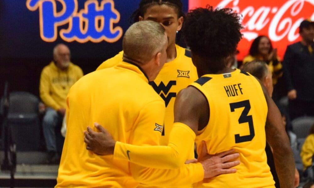 WVU Basketball huddle