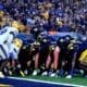 WVU Football offense lines up near end zone against Pitt in Backyard Brawl