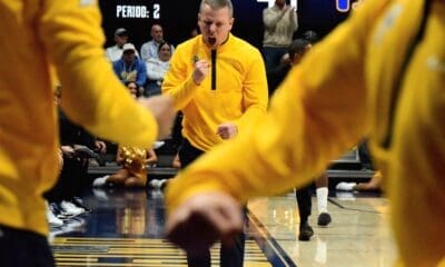 WVU Basketball Head Coach Ross Hodge screaming after beating Pitt in Backyard Brawl