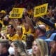 WVU Basketball Fans with Gold Rush sign