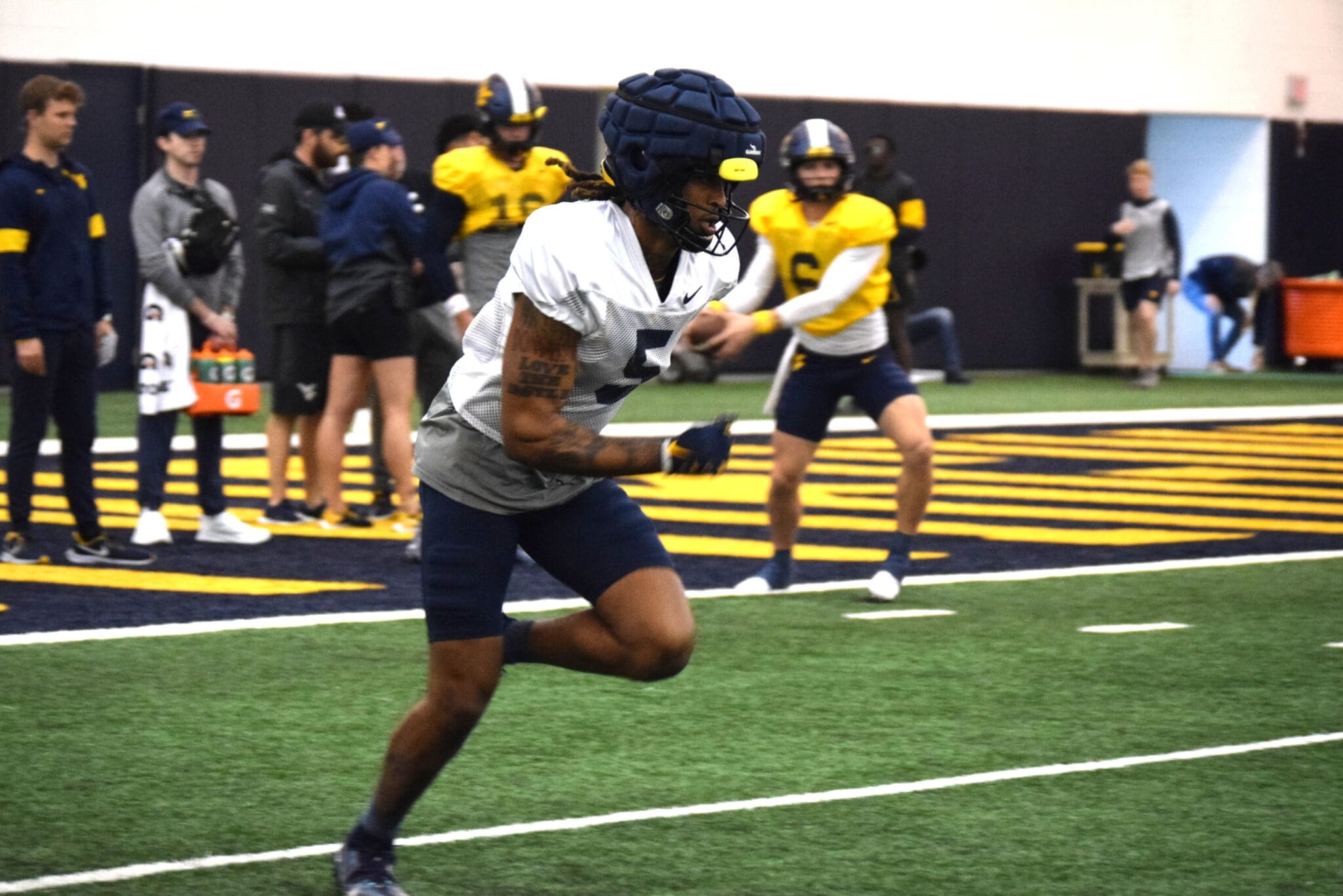 Devin Carter and Garrett Greene at WVU football practice.