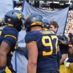 Davoan Hawkins Jr. celebrates with Jalen Thornton and other teammates