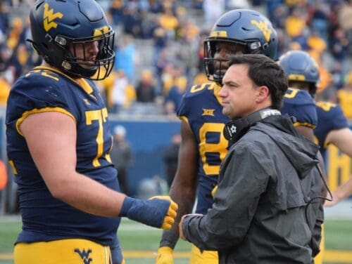 WVU Football head coach Neal Brown and offensive lineman Doug Nester