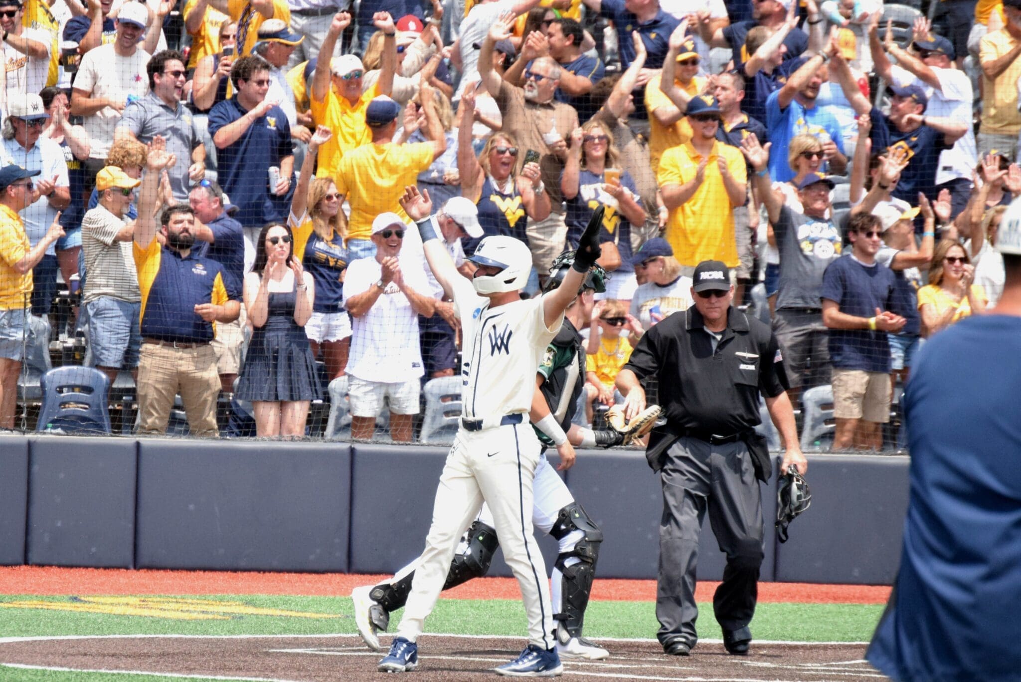 WVU Baseball celebrates after home run during Super Regional