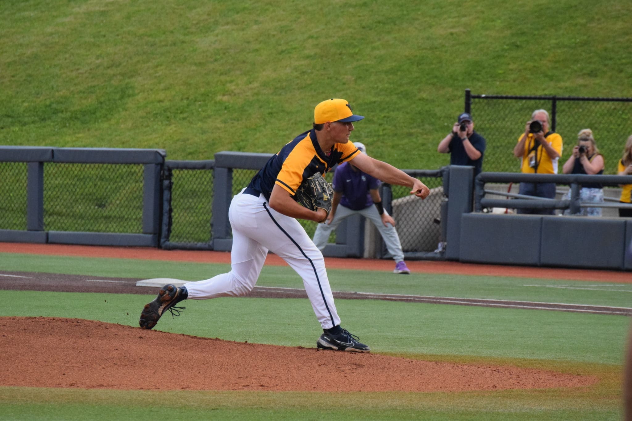 WVU Baseball pitcher Ben Hampton delivers a pitch.
