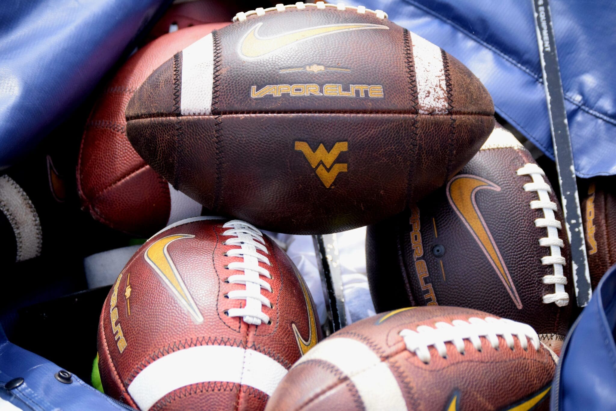 WVU Football logo on footballs stock