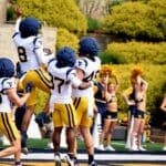 WVU Football defense celebrating during scrimmage