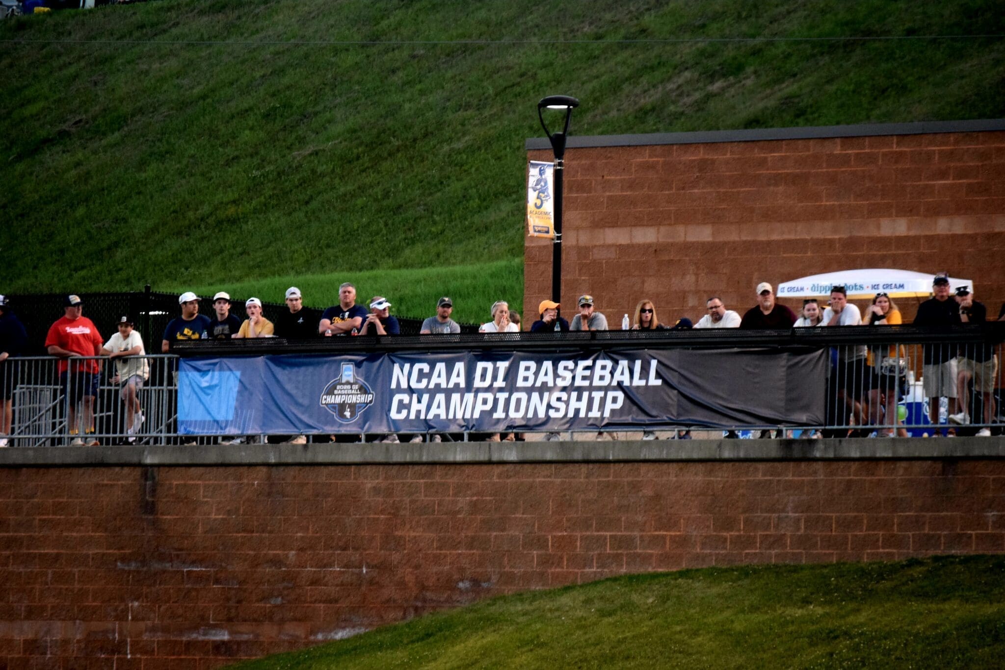 WVU Baseball fans behind NCAA Regional sign
