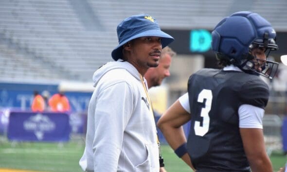 WVU Football legend Pat White with Michael Hawkins Jr.