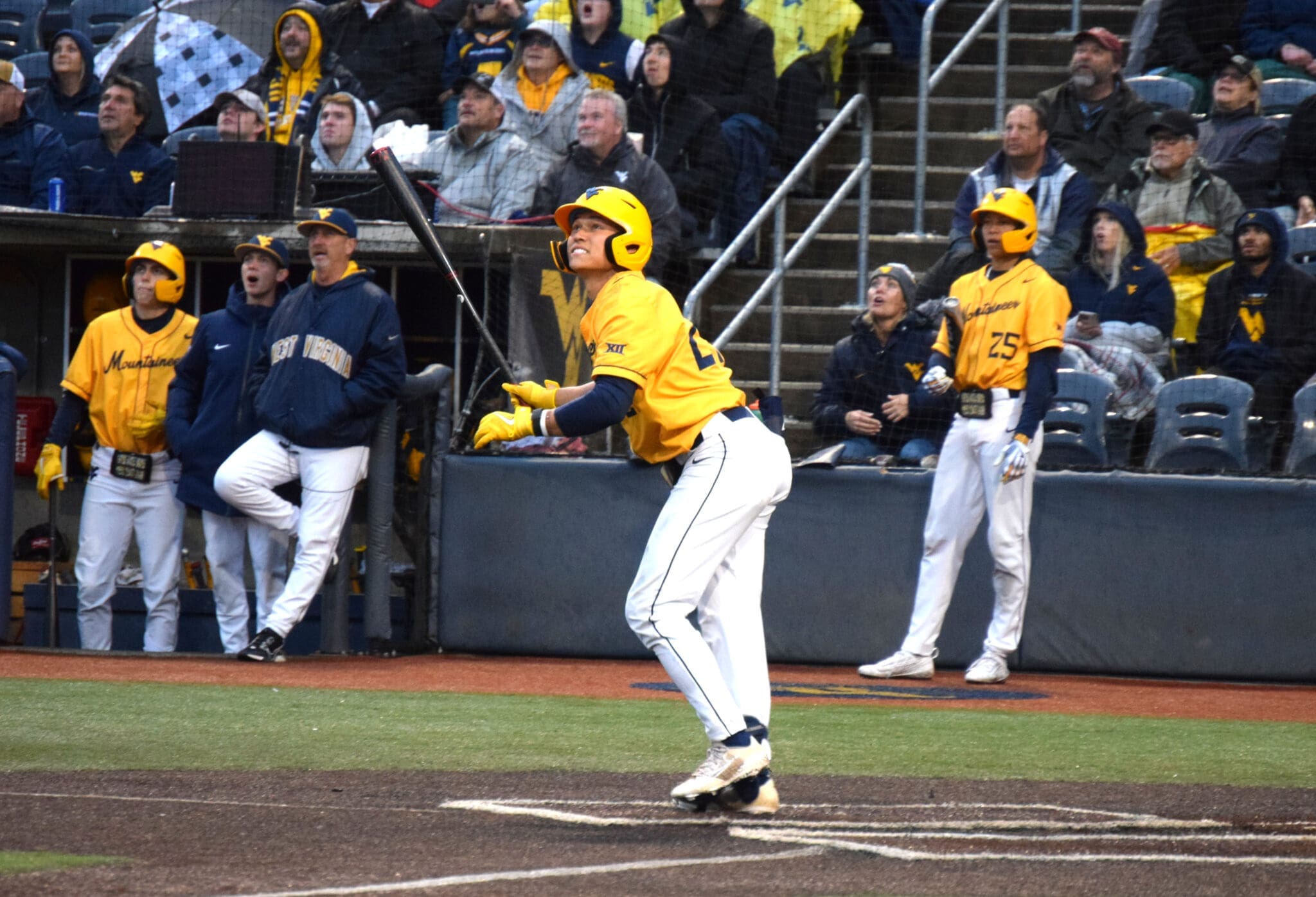 WVU Baseball JJ Wetherholt hitting and Randy Mazey looking on