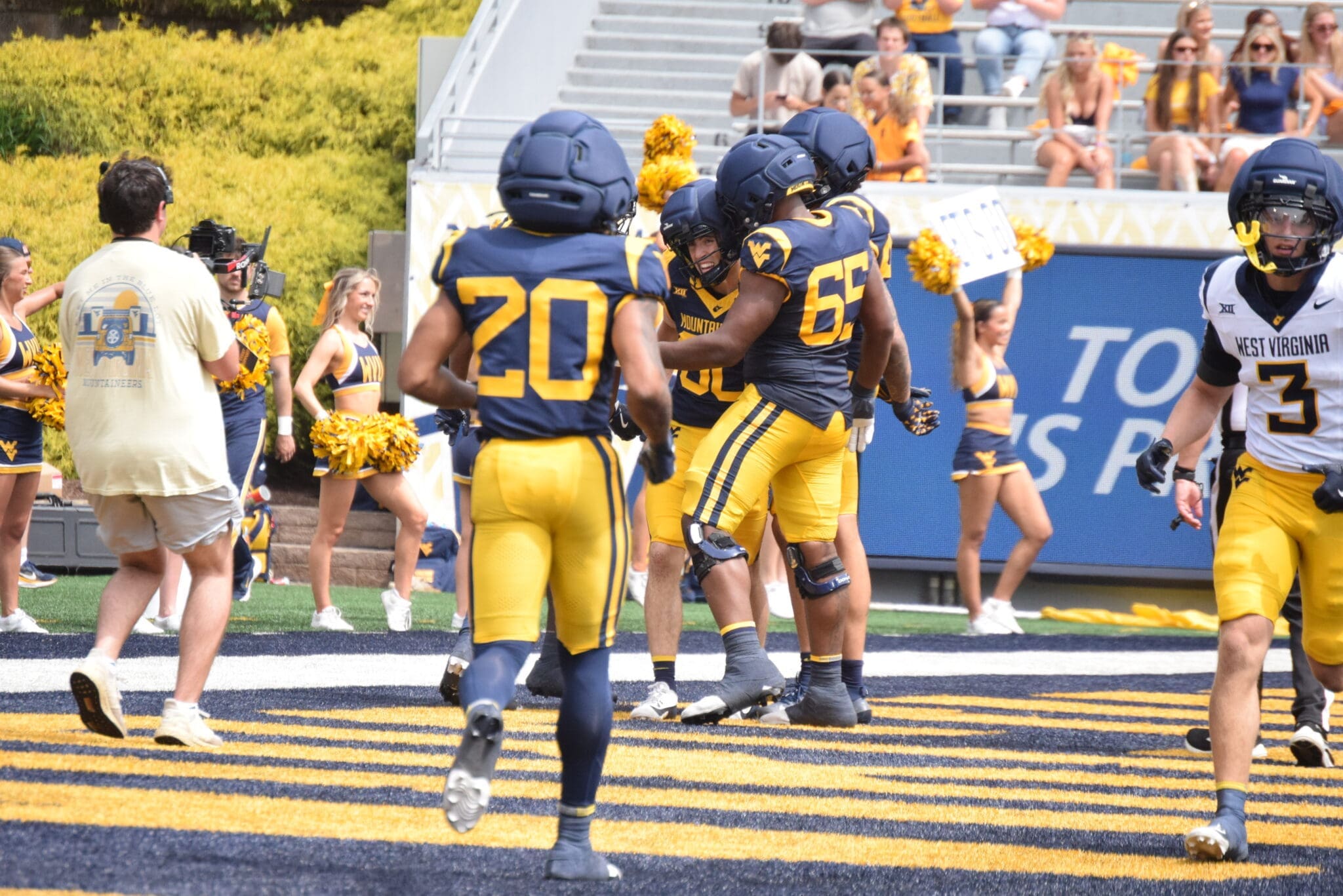 WVU Football RB Martavious Boswell runs to celebrate TD in end zone of scrimmage