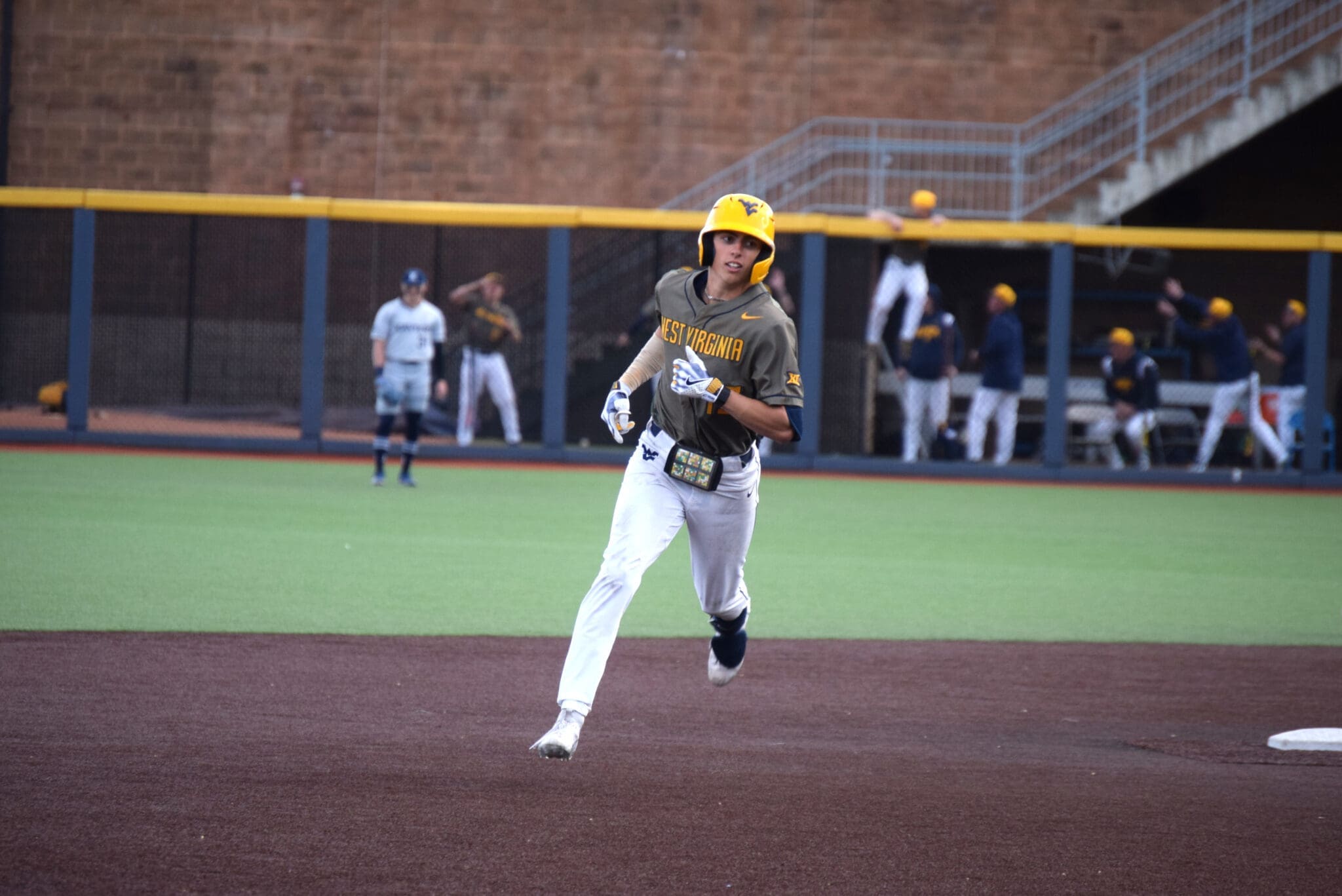 WVU Baseball center fielder Braden Barry rounds the bases.