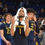 Emmitt Matthews Jr. symbolizes "WV" after win.