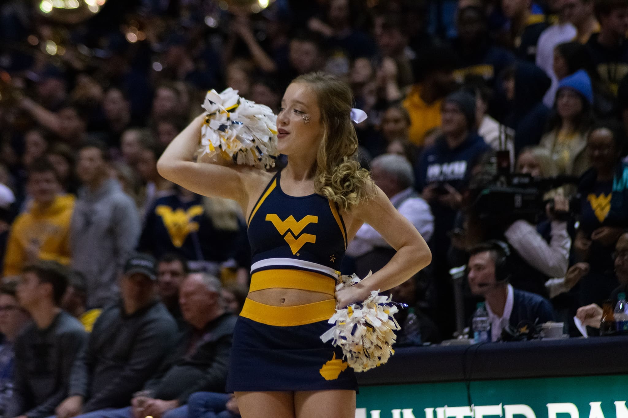 WVU Basketball cheerleader stock