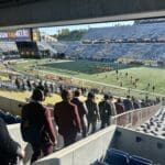 WVU Football players walking in Milan Puskar Stadium Stock