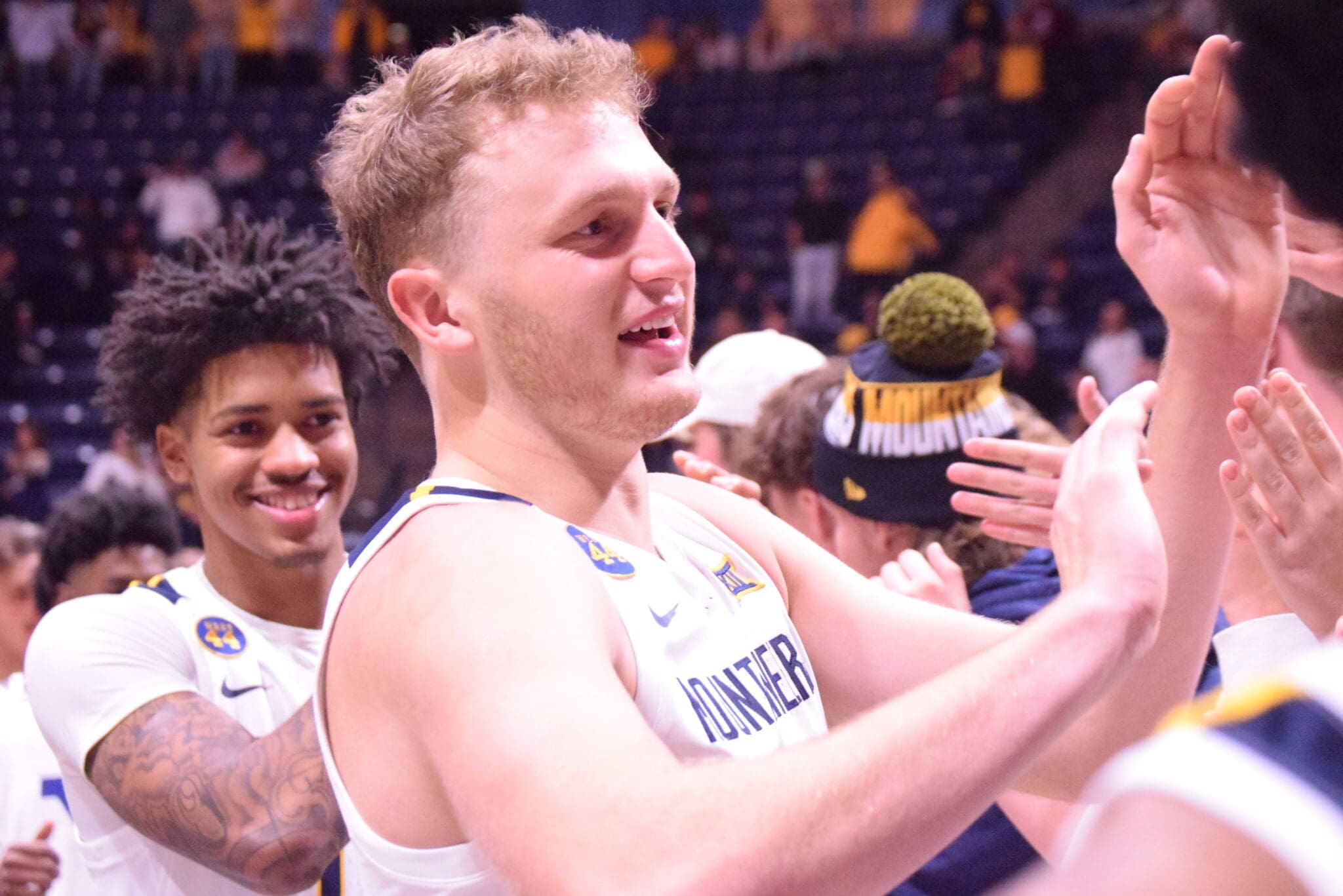 WVU Basketball Tucker DeVries with WVU fans