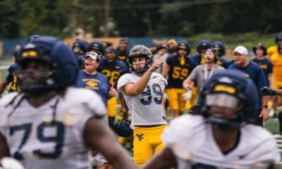 WVU Football team celebrate after Ethan Head makes kick at practice