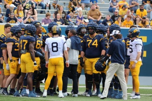 WVU Football players with Nicco Marchiol and Wyatt Milum
