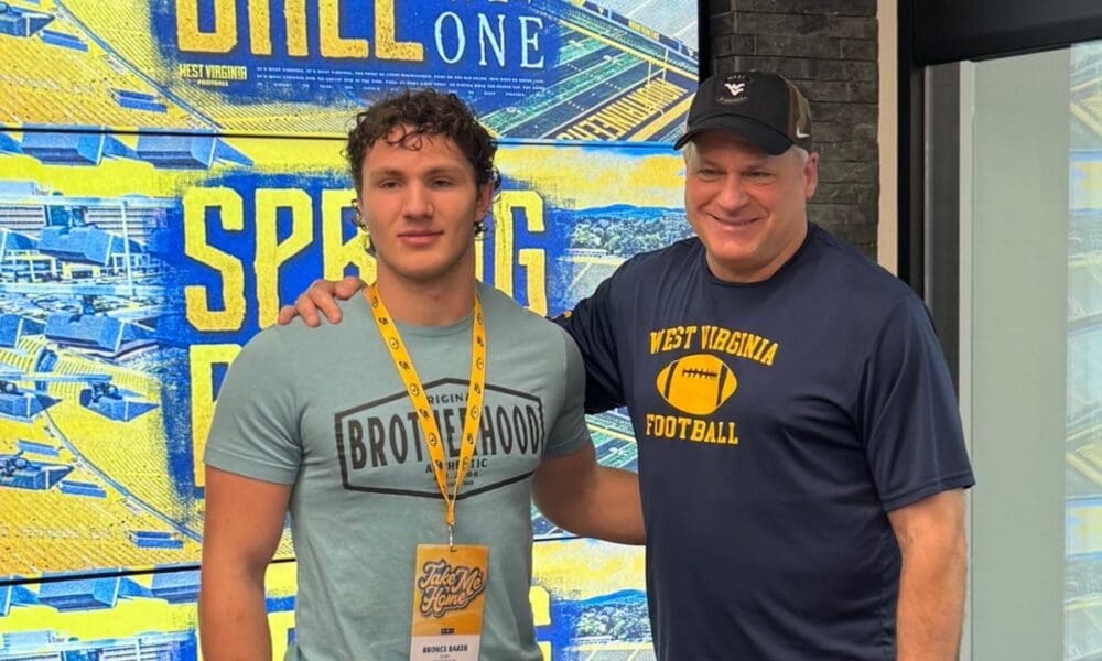 WVU Football HC Rich Rodriguez with Bronca Baker