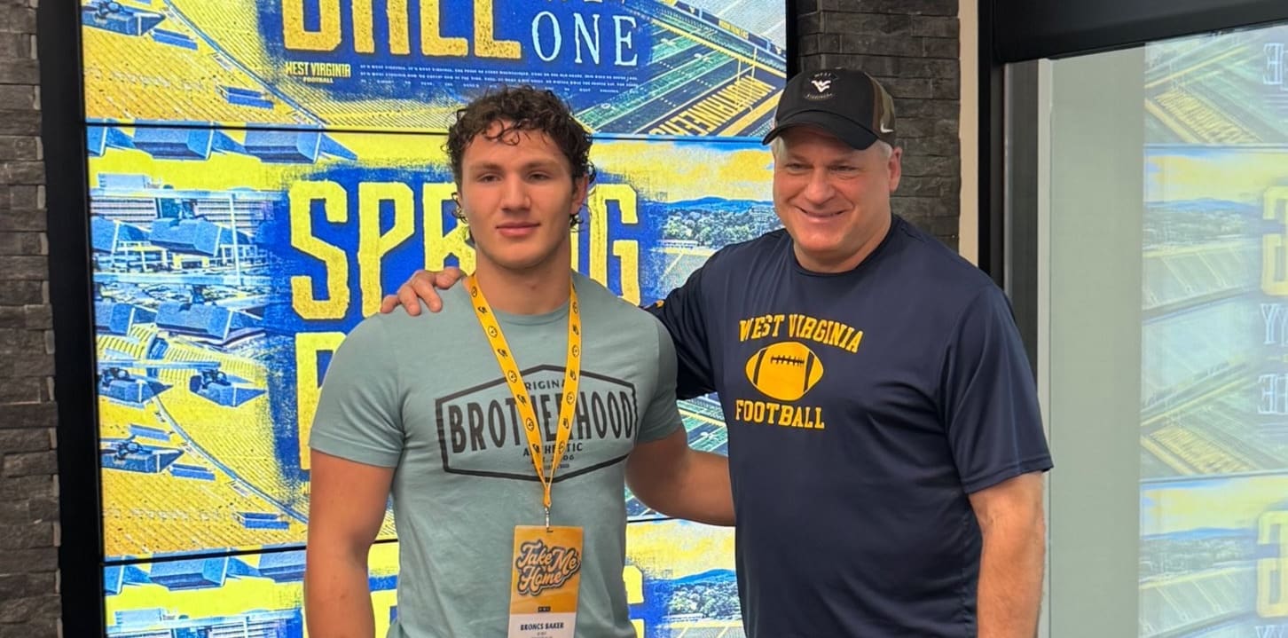 WVU Football HC Rich Rodriguez with Bronca Baker