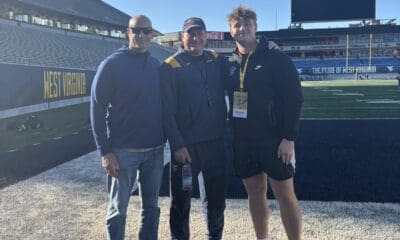 WVU Football DL recruit Carter Napier with Rich Rodriguez on field