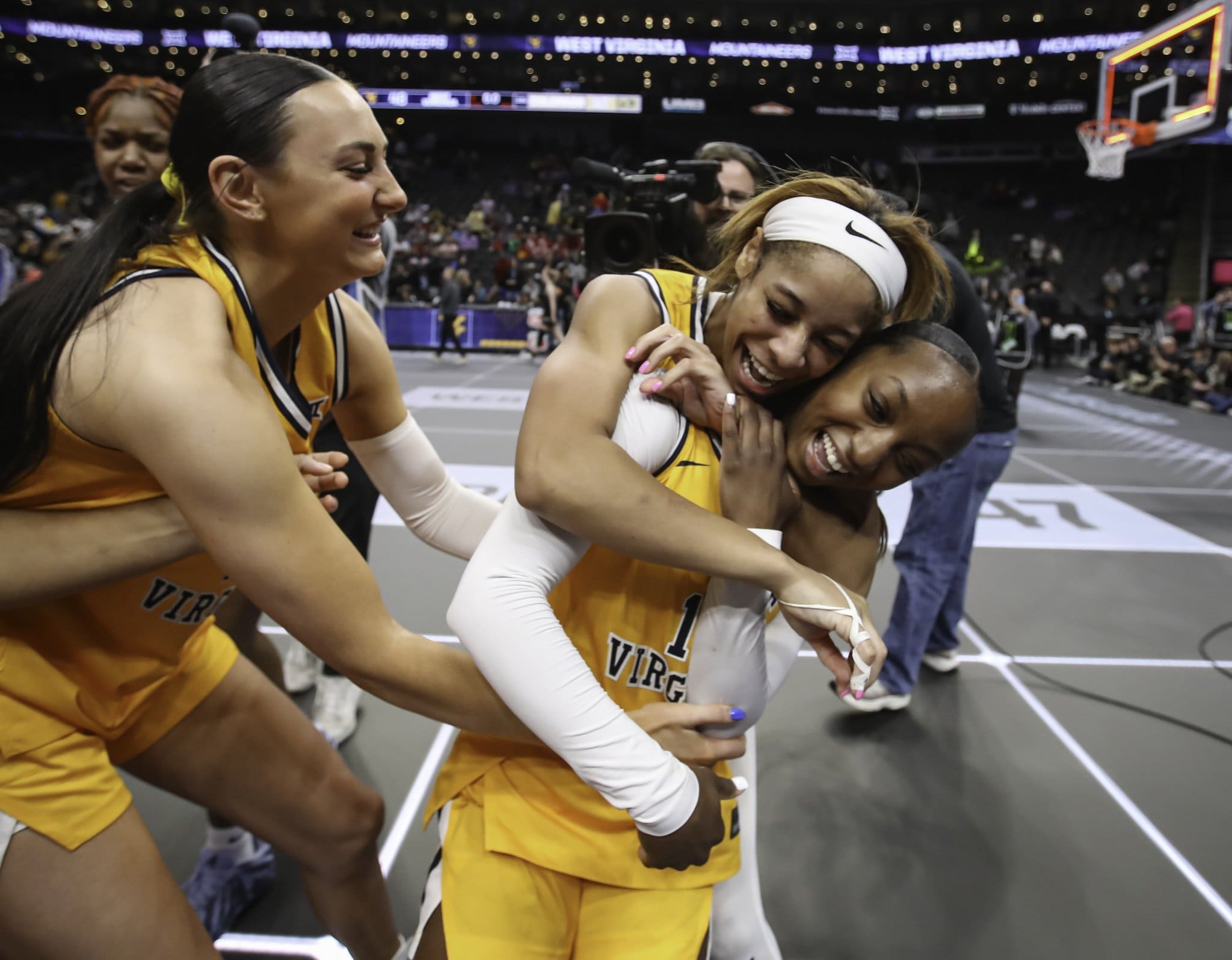 WVU women’s basketball team celebrates after a win in the Big 12 Tournament