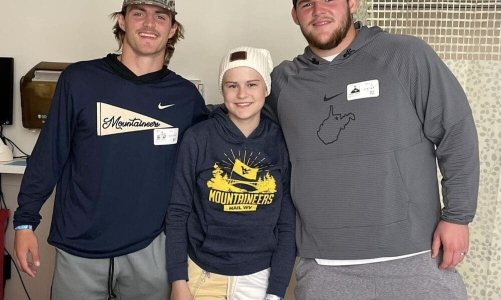 WVU Football players Garrett Greene and Zach Frazier visits girl in hospital
