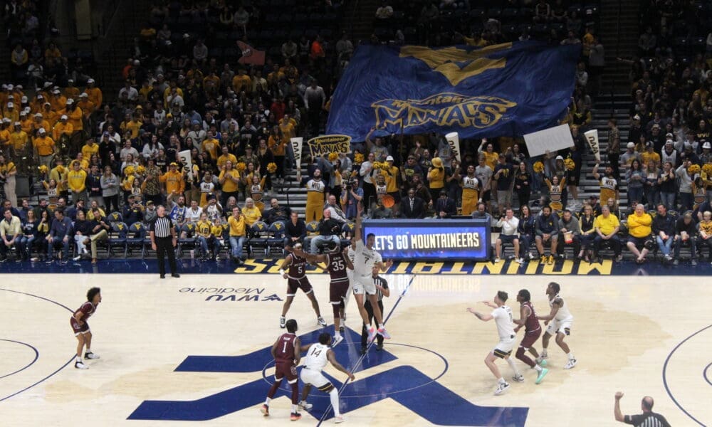 WVU Basketball crowd at Coliseum with Maniacs banner against Missouri State