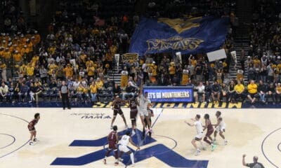 WVU Basketball crowd at Coliseum with Maniacs banner against Missouri State