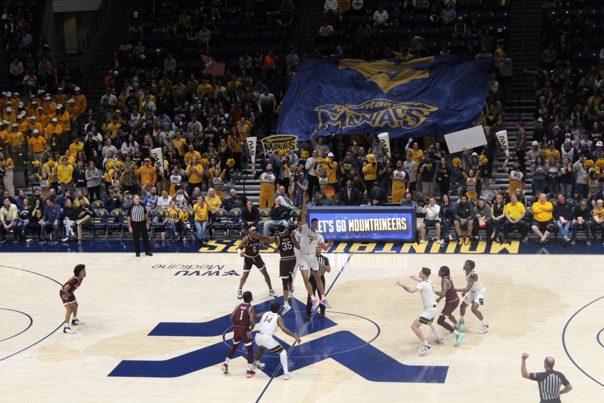 WVU Basketball crowd at Coliseum with Maniacs banner against Missouri State