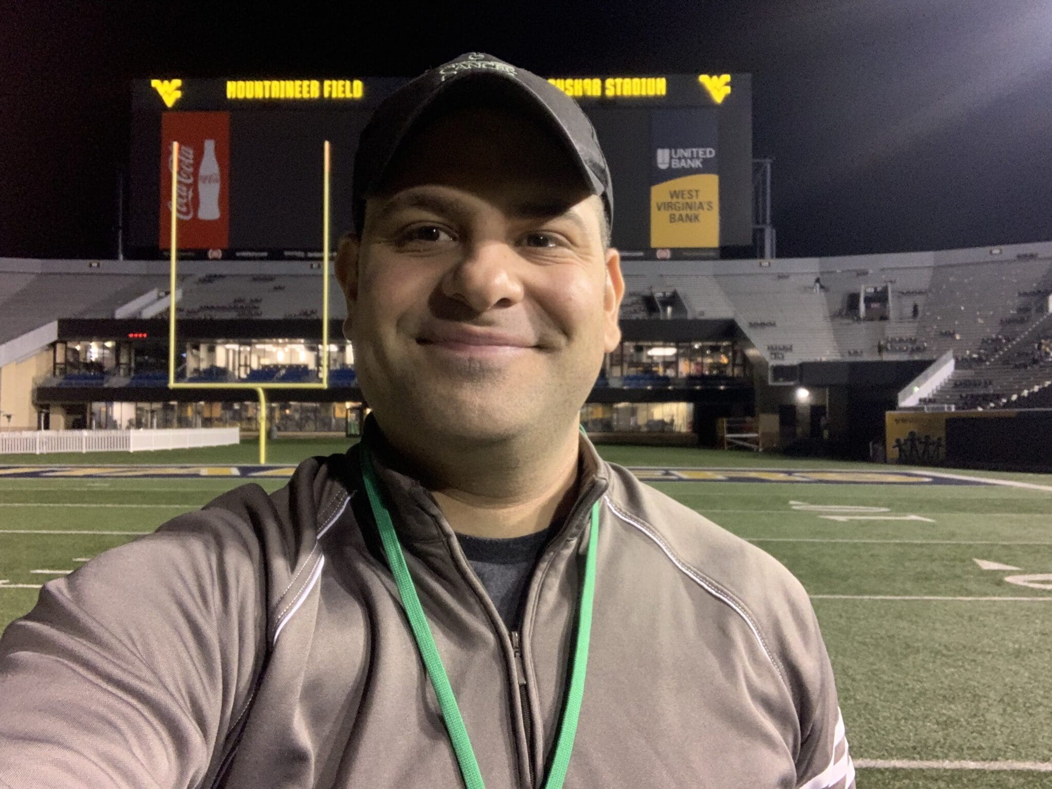 Mike Asti on WVU field at Milan Puskar Stadium