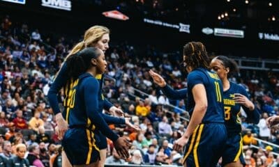 WVU Women's Basketball team huddle during Big 12 Tournament