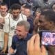 WVU Basketball HC Ross Hodge celebrating with Best Virginia team