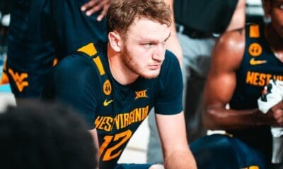 WVu basketball Tucker DeVries in huddle