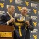 WVU Football HC Rich Rodriguez and AD Wren Baker