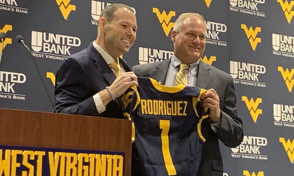 WVU Football HC Rich Rodriguez and AD Wren Baker